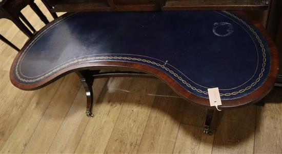 A leather top mahogany kidney shape coffee table W.128cm